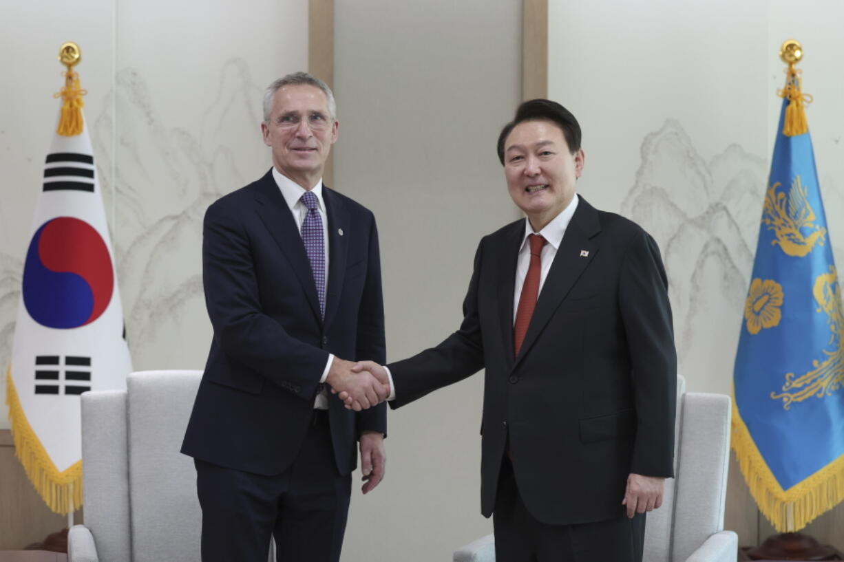 South Korean President Yoon Suk Yeol, right, shakes hands with NATO Secretary-General Jens Stoltenberg during a meeting at the presidential office in Seoul, South Korea, Monday, Jan. 30, 2023.