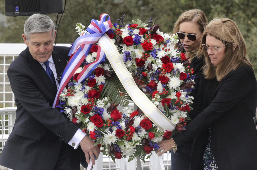 A wreath is presented by, from left, Bob Cabana, Associate Administrator of NASA; Janet Petro, NASA KSC director, and Sheryl Chaffee, daughter of Apollo 1 astronaut Roger Chaffee, during NASA's Day of Remembrance ceremony, hosted by the Astronauts Memorial Foundation at Kennedy Space Center Visitor Complex, Thursday, Jan. 26, 2023. NASA is marking the 20th anniversary of the space shuttle Columbia tragedy with somber ceremonies during its annual tribute to fallen astronauts.