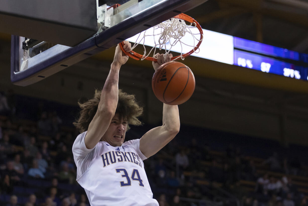 Washington center Braxton Meah dunks during the second half of the team's NCAA college basketball game against Stanford Thursday, Jan. 12, 2023, in Seattle.