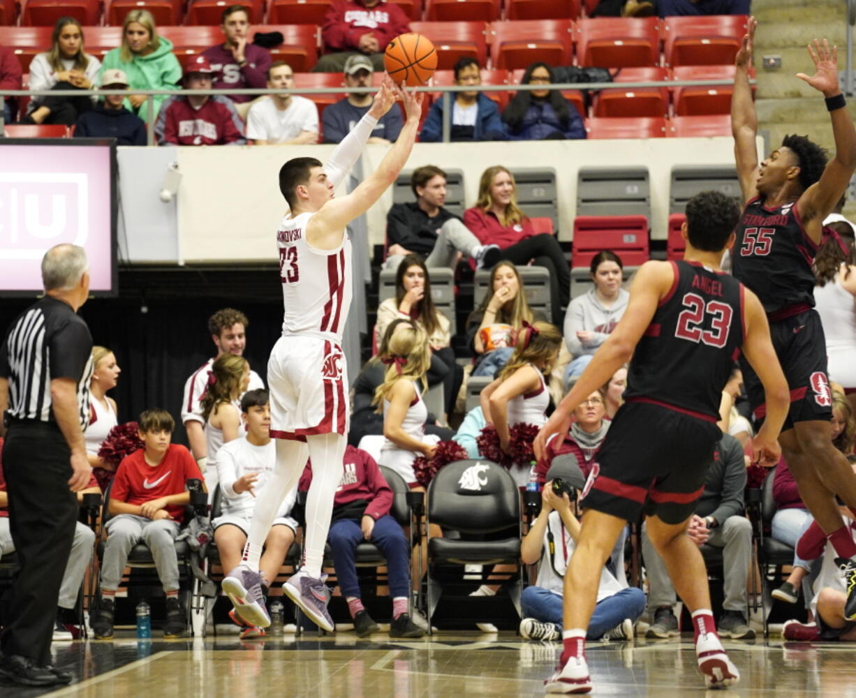 Washington State forward Andrej Jakimovski, center left, attempts a 3-point shot over Stanford forward Harrison Ingram (55) as forward Brandon Angel, center, watches during the first half of an NCAA college basketball game in Pullman, Wash., Saturday, Jan. 14, 2023.
