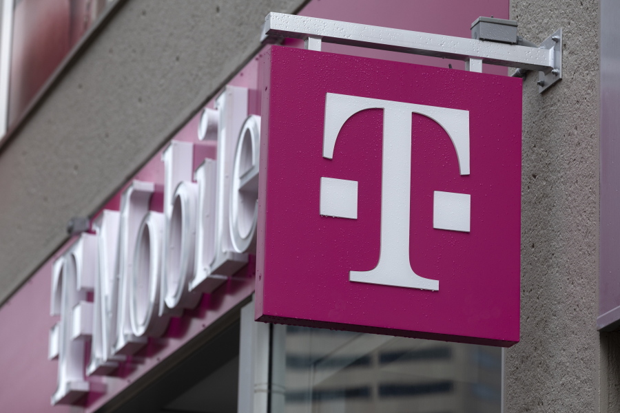 FILE - The T-Mobile logo is seen on a storefront, Oct. 14, 2022, in Boston. The U.S. wireless carrier T-Mobile said Thursday, Jan. 19, 2023, that an unidentified malicious intruder breached its network in late November and stole data on 37 million customers, including addresses, phone numbers and dates of birth.