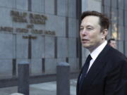 FILE - Elon Musk departs the Phillip Burton Federal Building and United States Court House in San Francisco, on Tuesday, Jan. 24, 2023. Tesla has received requests from the Justice Department for documents related to its Autopilot and "Full Self-Driving" features, according to a regulatory filing.