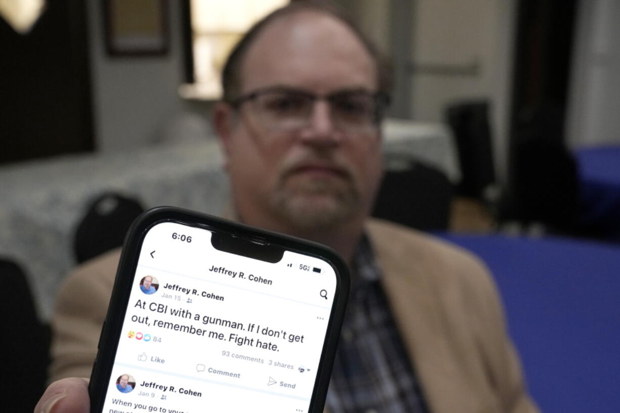 In this Dec. 22, 2022, photo, Jeff Cohen shows a Facebook posting he wrote shortly after being taken hostage at Congregation Beth Israel in Colleyville, Texas. A year ago, a rabbi and three others survived a hostage standoff at their synagogue in Colleyville, Texas. Their trauma did not disappear, though, with the FBI's killing of the pistol-wielding captor. Healing from the Jan. 15, 2022, ordeal is ongoing.