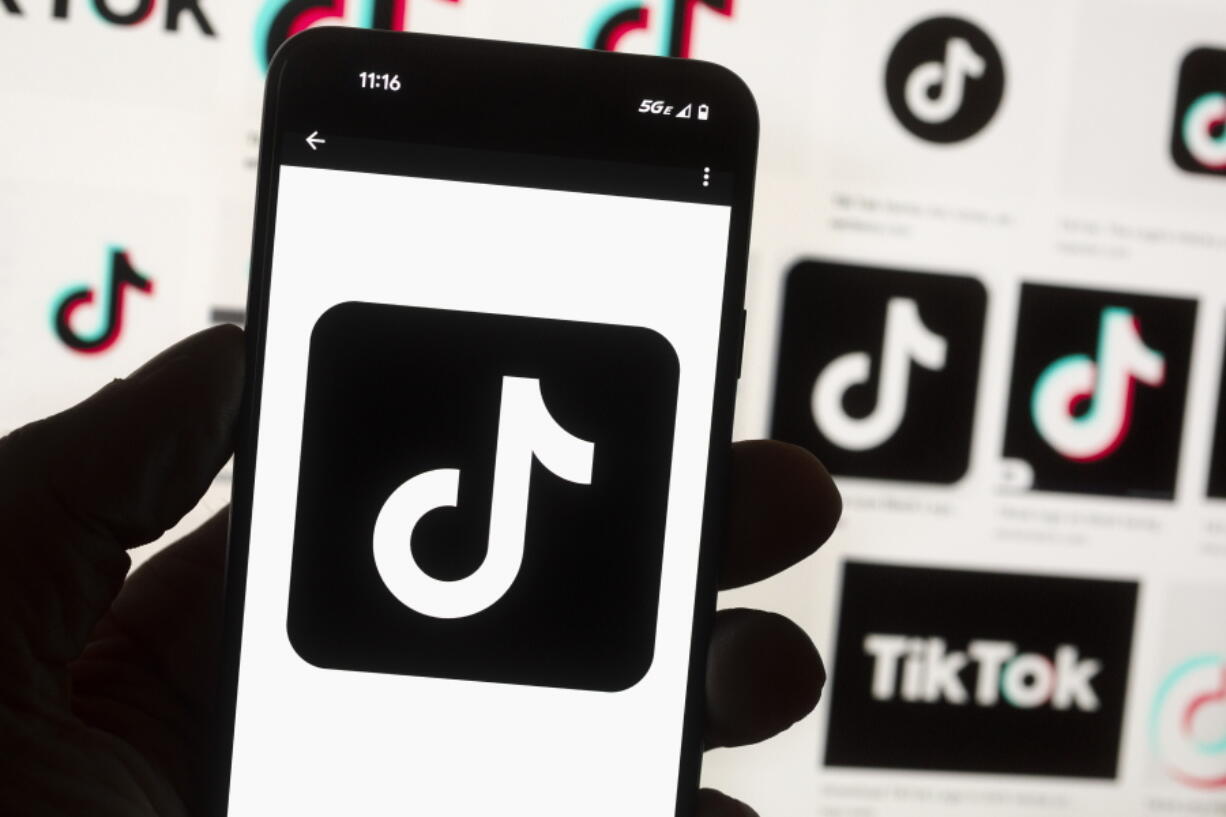 FILE - The TikTok logo is seen on a cell phone on Oct. 14, 2022, in Boston. On Thursday, Jan. 12, 2023, Wisconsin became the latest state to ban the use of TikTok on state phones and other devices, a move that comes amid a push for a federal ban and after nearly half of the states nationwide have blocked the popular app.