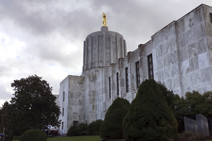 FILE - The Oregon state Capitol is seen in Salem, Ore., on Jan. 11, 2018. Oregon lawmakers will take up a full slate of legislation on pressing and polarizing issues from homelessness to gun control to abortion access when the legislative session starts next week after midterm elections that cost Democrats their supermajority but swept in a new, progressive governor.