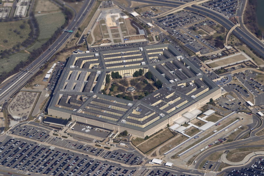 FILE - The Pentagon is seen from Air Force One as it flies over Washington, March 2, 2022. The Pentagon has formally dropped its COVID-19 vaccination mandate, but a new memo signed by Defense Secretary Lloyd Austin also gives commanders some discretion in how or whether to deploy troops who are not vaccinated.