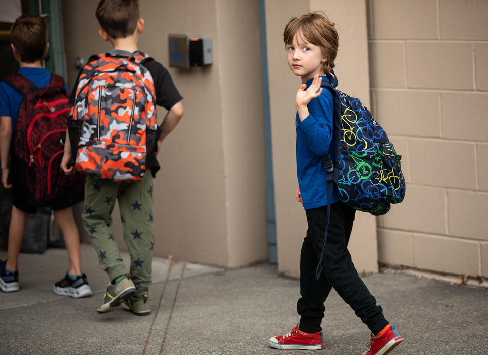 Orion Muller waves goodbye to his mother on Wednesday, Sept. 14, 2022, his first day of kindergarten at Greenwood Elementary. Washington is the only state that doesn't require kids to start school until age 8.