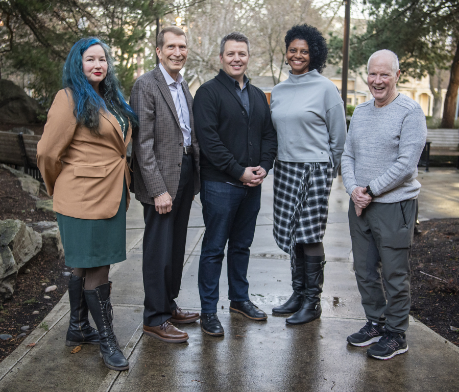 Community Foundation for Southwest Washington board members Karissa Lowe, from left, T. Randall Grove, president Matt Morton, Vanessa Gaston, and George Middleton stand for a portrait outside the CFSW office in downtown Vancouver following a board meeting.
