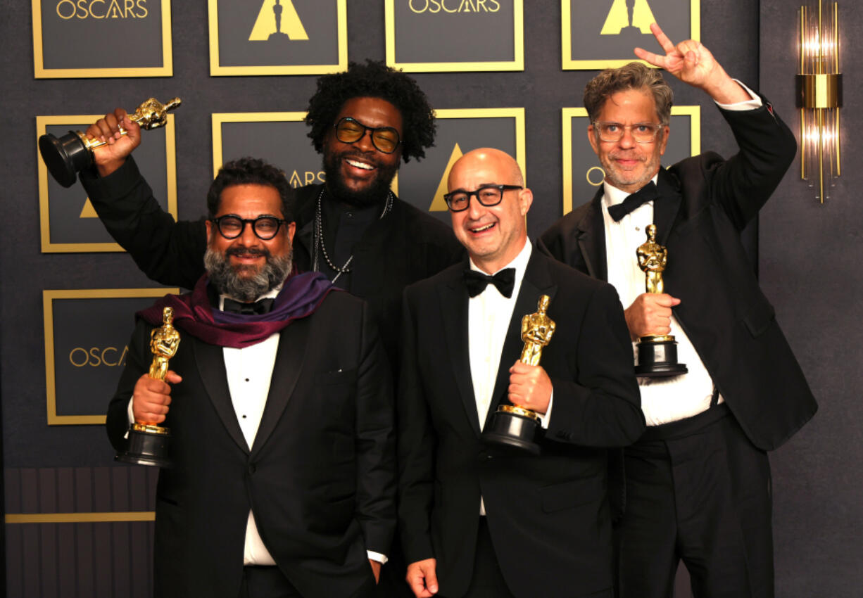 From left, Joseph Patel, Ahmir "Questlove" Thompson, David Dinerstein and Robert Fyvolent, winners of Best Documentary Feature for "Summer of Soul," pose in the press room during the 94th Academy Awards on March 27, 2022, in Hollywood, California.