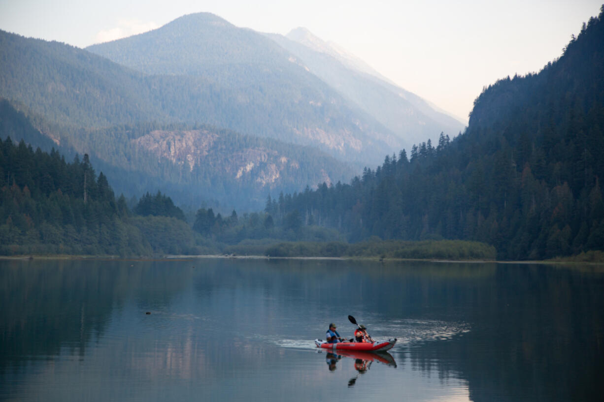 Kayakers glide through the waters of Diablo Lake in North Cascades National Park in October 2022.