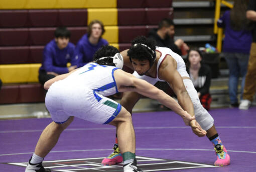 Prairie's Alex Ford, right, and Mountain View's Elijah Mar wrestle in the 170-pound championship match at the Class 3A Greater St. Helens League district wrestling championships on Saturday, Feb. 4, 2023 at Prairie High School. (Micah Rice/The Columbian)