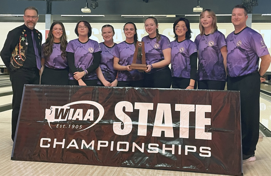 Columbia River bowlers and coaches pose for photos with their second-place trophy at the 1A/2A state championships on Saturday at Bowlero in Tukwila. The Rapids? senior class of six earned three runner-up state finishes in four seasons.