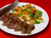 Glazed Steak with Sweet Potatoes and Zucchini.