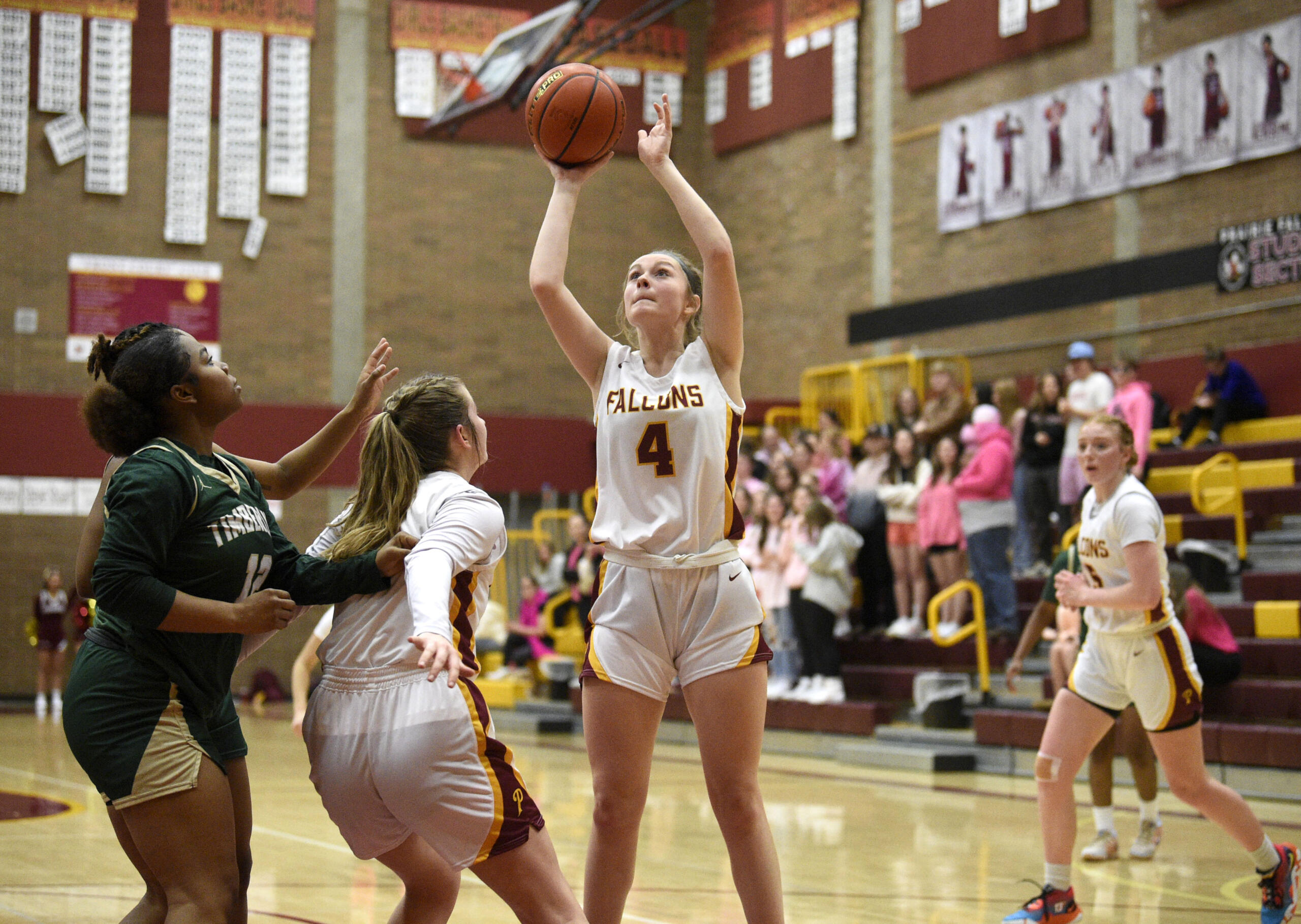 Prairie’s Claire Smith, center, gets ready to release a shot during a Class 3A bi-district game against Timberline on Friday, Feb. 10, 2023, at Prairie High School.