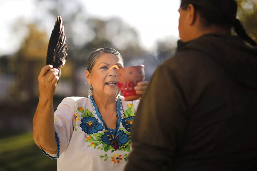 Grace Sesma, a curandera, leads a spiritual cleansing with a client at her home in Alpine on November, 22, 2022. (K.C.