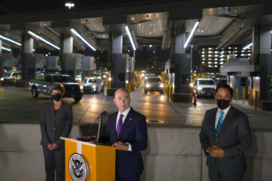 Speaking to news reporters at San Ysidro Port of Entry on Tuesday, Dec. 7, 2021, in San Diego. Accompanying him is San Diego Mayor Todd Gloria, right. (Nelvin C.