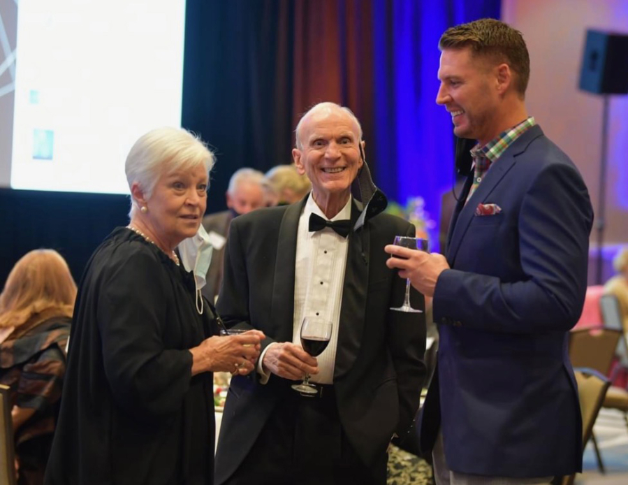 Paul Christensen is all smiles at a recent Vancouver Symphony Orchestra gala event. With him are Ginger Metcalf and David Gellatly.