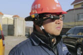 Workers for State Grid, China's state utility company, work in the field using RealWare's headset.(Contributed photo)