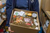 Clark County Veterans Assistance Center Vice President Ruth Lakel holds a box of food at the center. The organization operates a food pantry that gives out boxes to individuals and families.