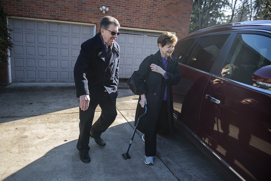 Volunteer Bruce Eavey of Villages Clark County, left, escorts Frankie Shetterly to the car while picking her up for a medical appointment. Villages Clark County helps older people stay in their homes by providing volunteers for small household tasks and errands.