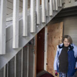 More than three months after a fire at Fox Pointe apartments, resident Wilma Pomeroy's one-bedroom unit still has no electricity or hot water. Plywood was put over her front door after firefighters kicked it in. (Amanda Cowan/The Columbian)