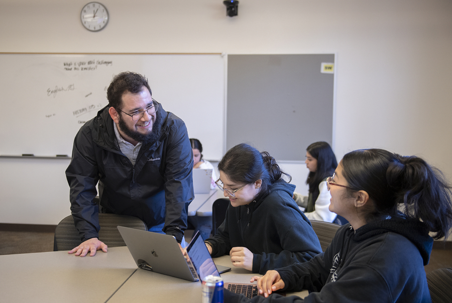 Instructor Sawyer Barragan, from left, works with freshman Isela Bonilla and sophomore Nayeli Lopez-Martinez during their University 250 class at Washington State University Vancouver on Thursday afternoon. The class aims to help freshmen adjust to campus life while working with an adviser to explore academic and career opportunities.