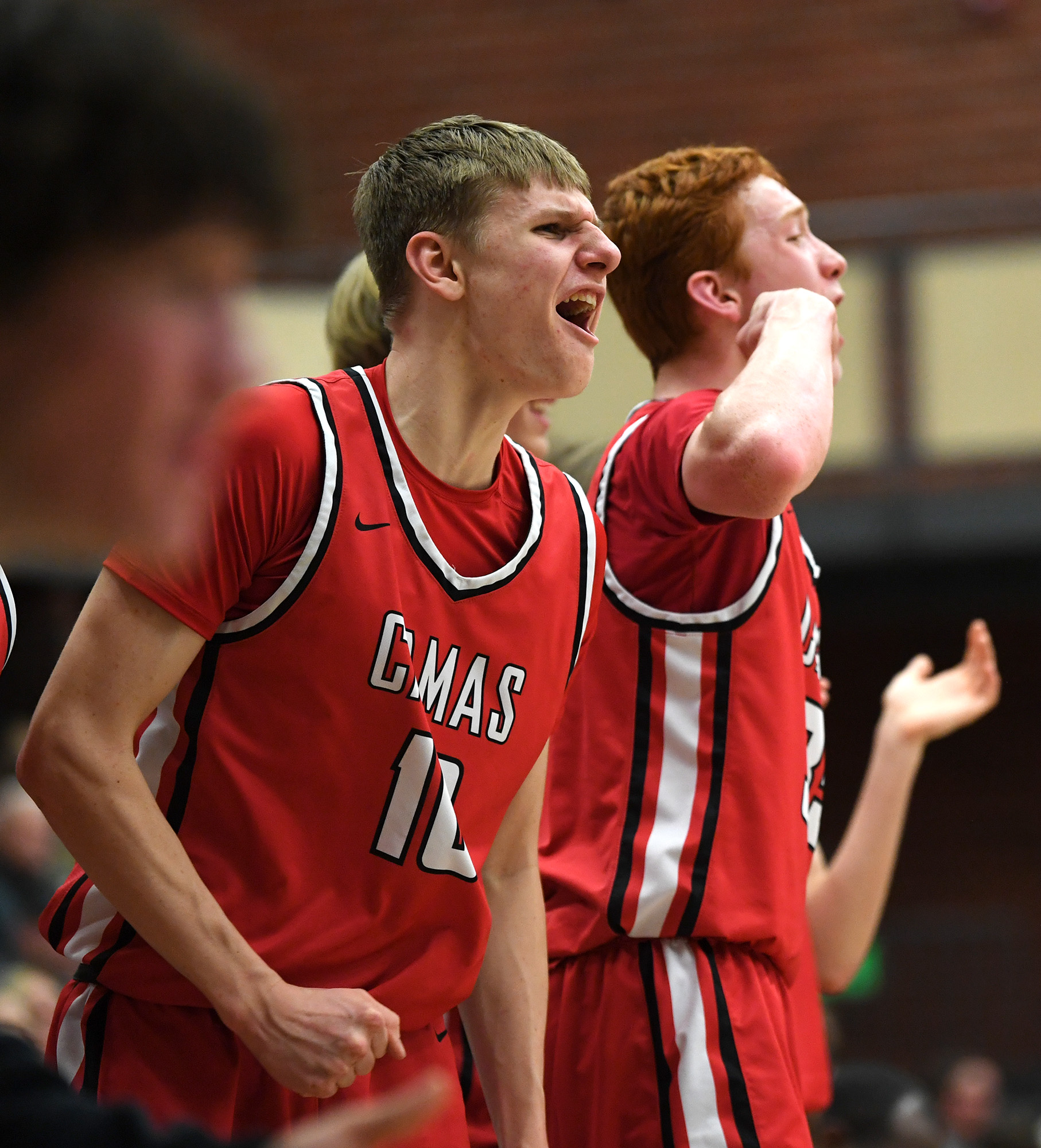Camas junior Matthew Sitler, left, and freshman Ethan Harris celebrate after a basket Friday, Feb. 3, 2023, during the Papermakers’ 76-65 loss to Union at Union High School.