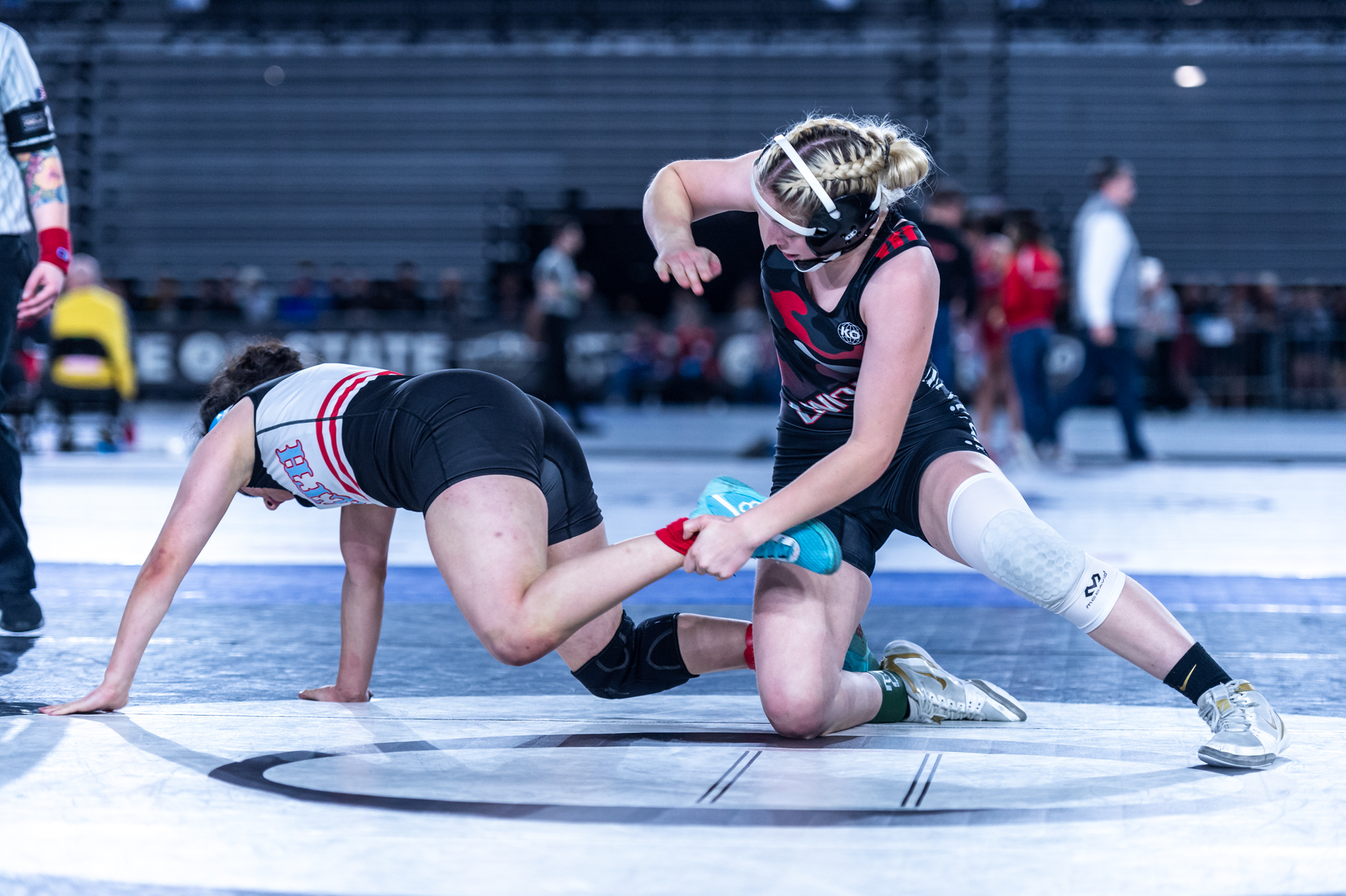Union’s Niah Cassidy, 125 pounds, chases down Chief Sealth's Alyssa Reyes at Mat Classic XXXIV on Friday, February 17, 2023, at the Tacoma Dome.