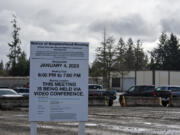 A sign advertises a past neighborhood meeting about Knife River's planned concrete batch plant on Northeast 101st Street. While the company hasn't filed a permit request yet, opponents are already organizing.