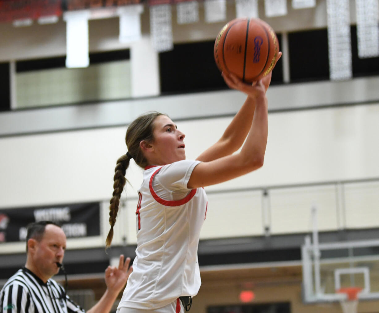 Camas sophomore Sophie Buzzard shoots the ball Friday, Feb. 24, 2023, during the Papermakers' 52-48 win against Kamiakin at Battle Ground High School.