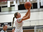 Camas sophomore Sophie Buzzard shoots the ball Friday, Feb. 24, 2023, during the Papermakers' 52-48 win against Kamiakin at Battle Ground High School.