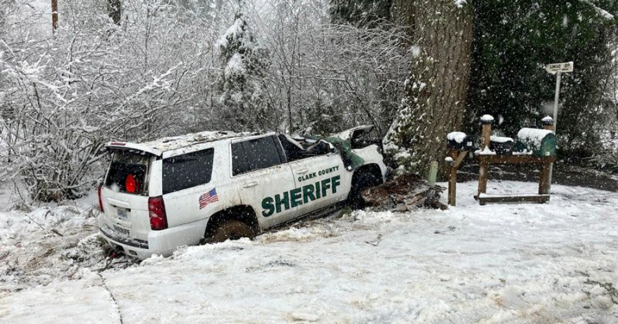 The Clark County Sheriff's Office SUV Deputy Drew Kennison was driving Wednesday stopped against a tree after part of another snow-heavy tree fell on it on Washougal River Road. Kennison underwent surgeries at area hospitals, including a partial amputation of his left leg.