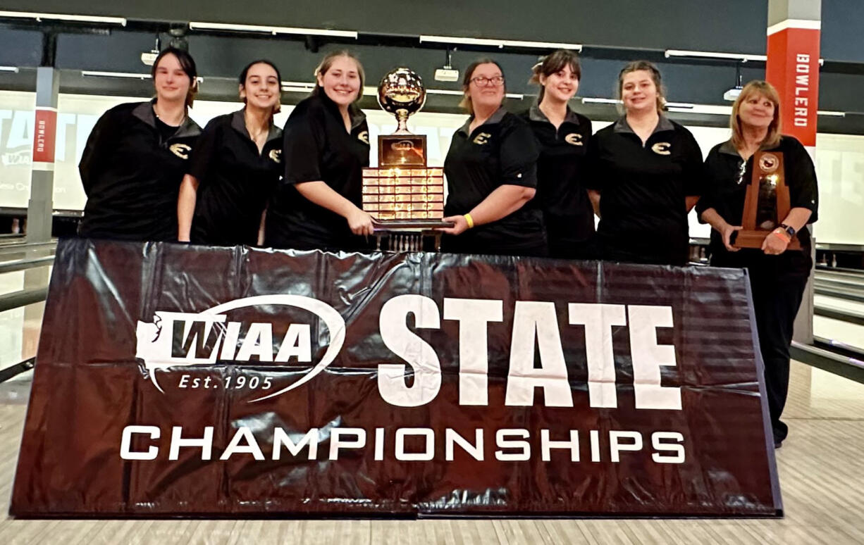 Evergreen girls bowling with the 3A state championship trophy on Thursday, Feb. 2, 2023, at Bowlero in Tukwila. It is the Plainsmen’s fifth state title out of the last six tournaments held.