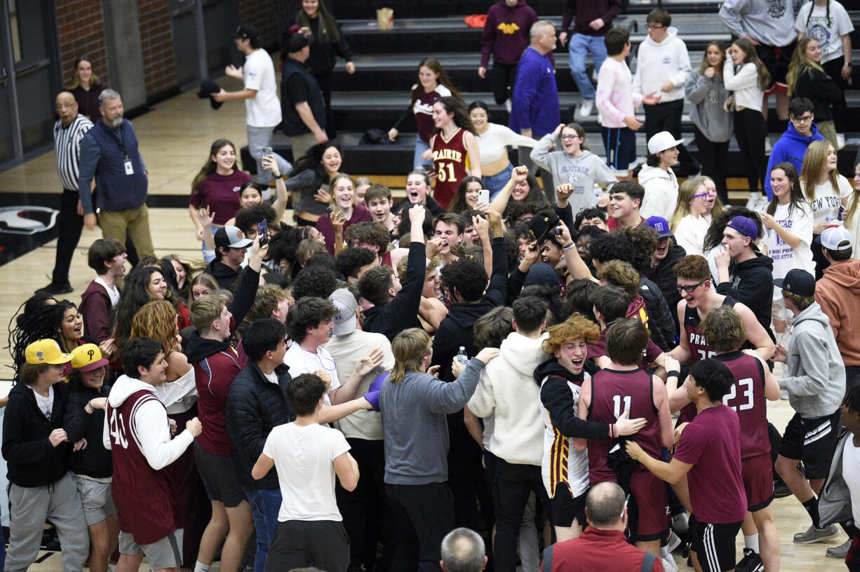 Prairie players and students celebrate the Falcons' 30-29 win over Evergreen in a 3A Greater St. Helens League tiebreaker at Union High School on Monday, Feb. 6, 2023.