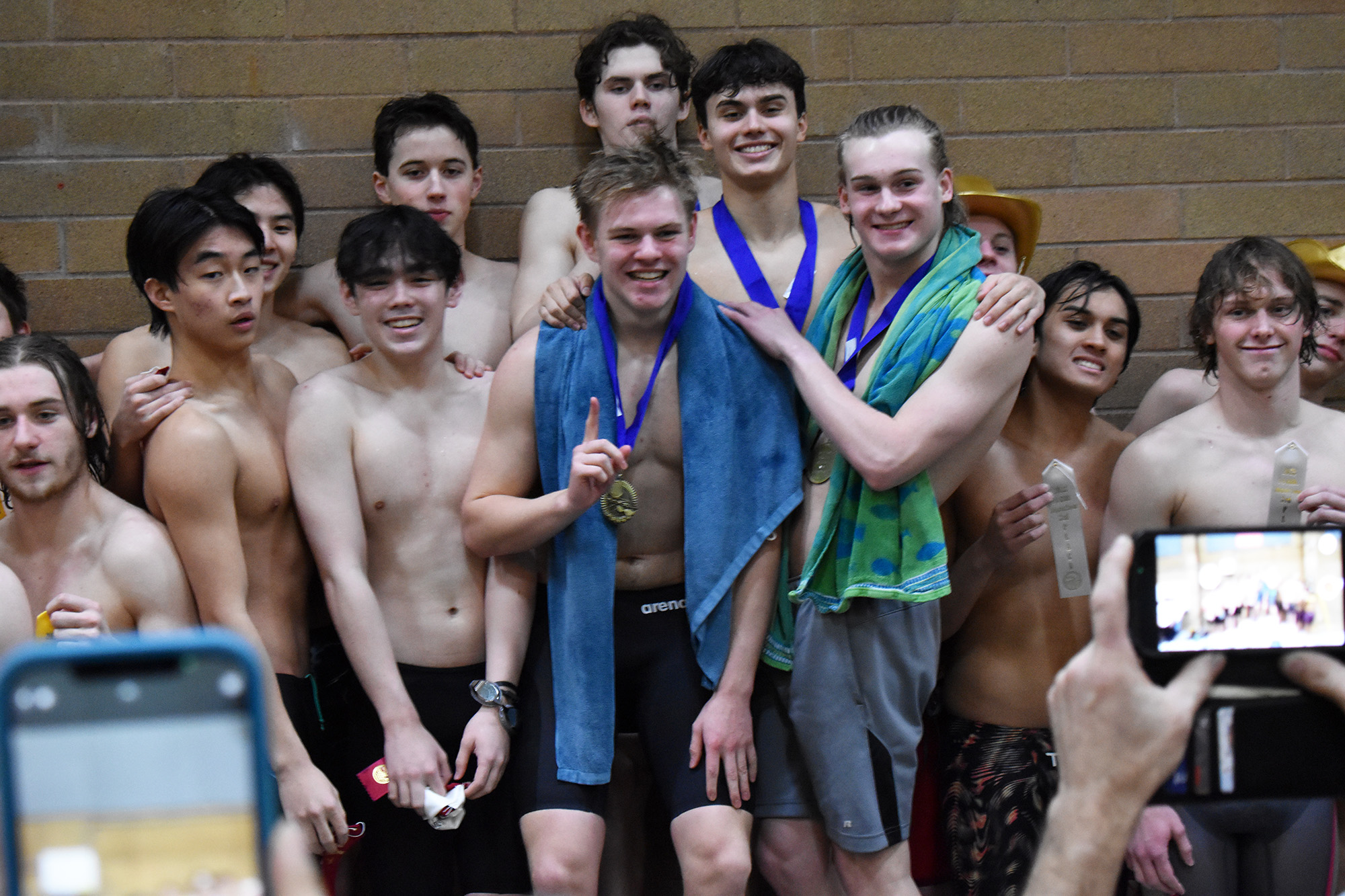 Union's 400 free relay team of Alexander Wahlman, Owen Robertson, Steven Empey and Sam Empey stand on the podium after taking first place at the 4A District 4-8 meet at Kelso High School on Saturday, Feb. 4, 2023.