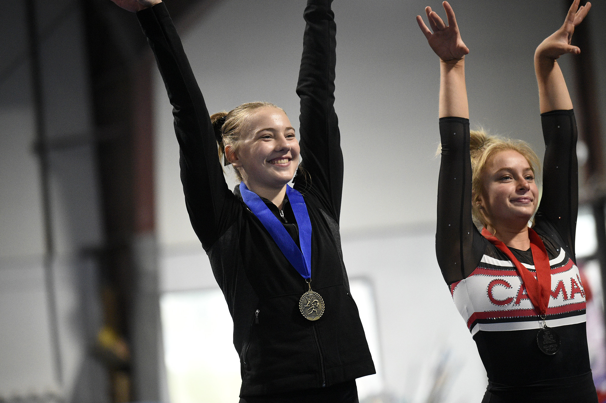 Camas' Madi Williams edged out teammate Hallie Kempf (right) to win the all-around title at the 4A District 4 gymnastics meet at Northpointe on Saturday, Feb. 11, 2023.