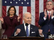 President Joe Biden delivers the State of the Union address to a joint session of Congress at the U.S. Capitol, Tuesday, Feb. 7, 2023, in Washington, as Vice President Kamala Harris and House Speaker Kevin McCarthy of Calif., applaud.