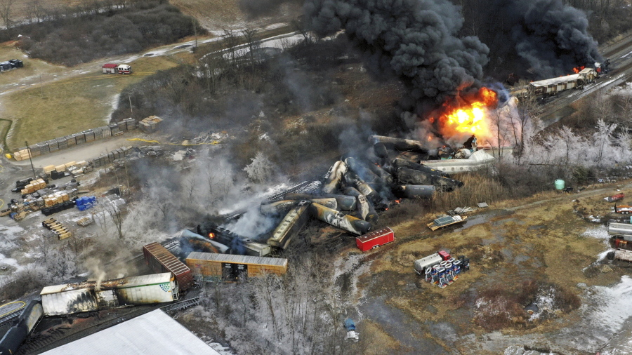This photo taken with a drone shows portions of a Norfolk and Southern freight train that derailed Friday night in East Palestine, Ohio are still on fire at mid-day Saturday, Feb. 4, 2023. (AP Photo/Gene J.