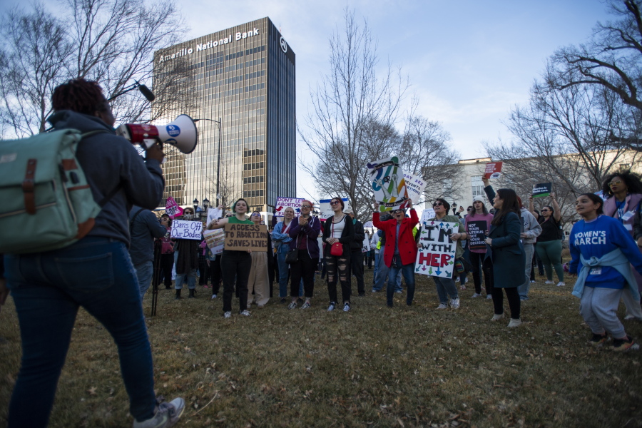 People gather in front of the J. Marvin Jones Federal Building and Mary Lou Robinson United States Courthouse to protest a lawsuit to ban the abortion drug mifepristone Saturday, Feb. 11, 2023, in Amarillo, Texas.