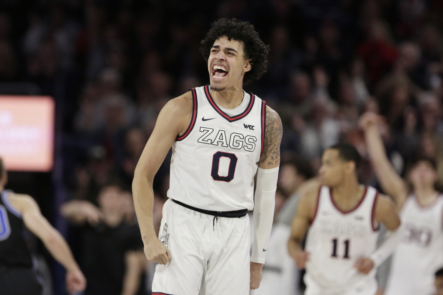 Gonzaga guard Julian Strawther (0) celebrates his basket during the second half of the team's NCAA college basketball game against BYU, Saturday, Feb. 11, 2023, in Spokane, Wash. Gonzaga won 88-81.