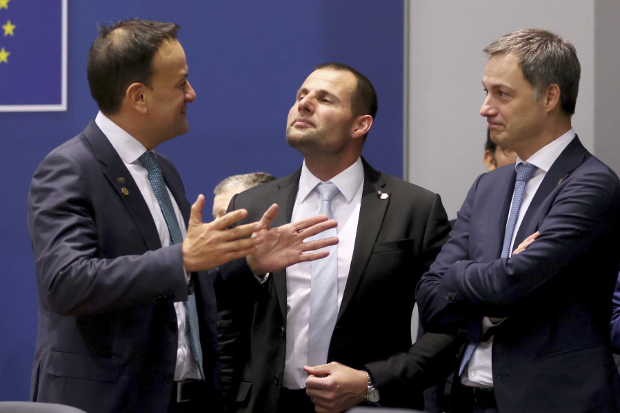 Ireland's Prime Minister Leo Varadkar, left, speaks with Malta's Prime Minister Robert Abela, center, and Belgium's Prime Minister Alexander De Croo prior to a meeting with Ukraine's President Volodymyr Zelenskyy on the sidelines of an EU summit in Brussels on Thursday, Feb. 9, 2023. European Union leaders are meeting for an EU summit on Thursday to discuss Ukraine and migration.