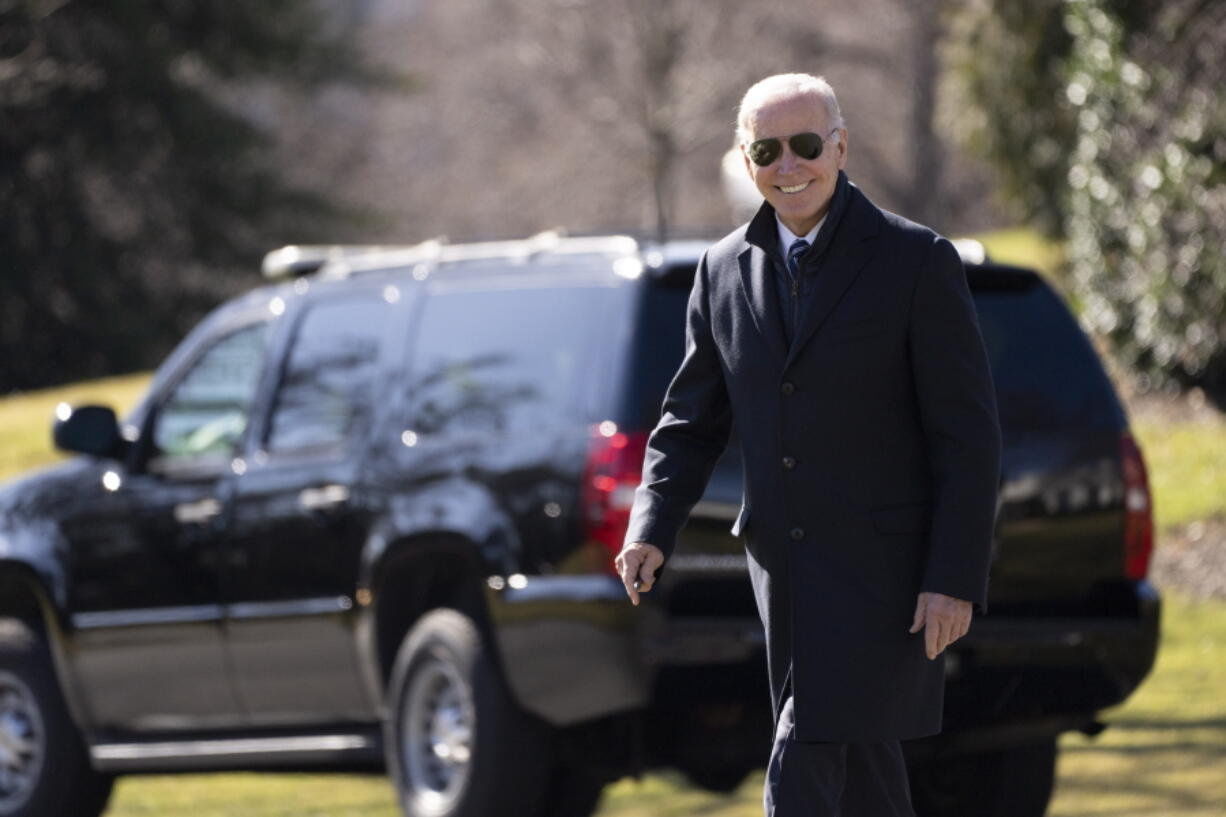 President Joe Biden smiles as he walks on the South Lawn of the White House, Friday, Feb. 3, 2023, in Washington. Biden is traveling to Philadelphia.