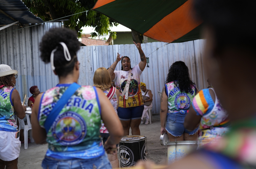 Members of the Turma da Paz de Madureira, or TPM, samba school rehearse in preparation for Rio's Carnival parade, in Rio de Janeiro, Brazil, Saturday, Feb. 4, 2023. TPM is the first all-female samba school in Rio.