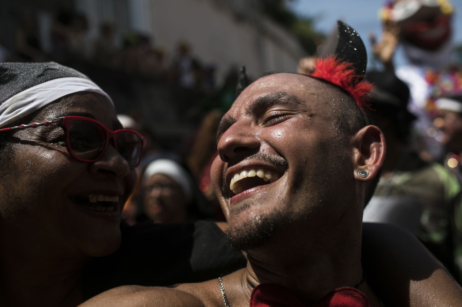 Revelers attend the Carmelitas street party on the first day of Carnival in Rio de Janeiro, Brazil, Friday, Feb. 17, 2023.