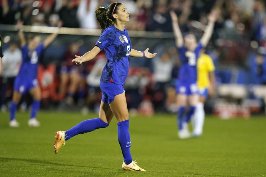 United States forward Alex Morgan (13) reacts to scoring a goal during the first half of a SheBelieves Cup soccer match against Brazil Wednesday, Feb. 22, 2023, in Frisco, Texas.