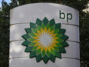 FILE - A logo of BP is seen at a gas station in London, on Nov. 1, 2022. British energy company BP reported record annual earnings on Tuesday, Feb. 7, 2023 amid growing calls for the U.K. government to boost taxes on companies profiting from the high price of oil and natural gas after Russia's invasion of Ukraine.