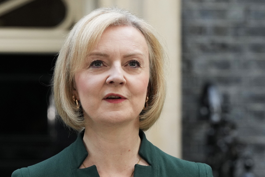FILE - Outgoing British Prime Minister Liz Truss speaks outside Downing Street in London, on Oct. 25, 2022. Truss will join the former leaders of Australia and Belgium at a conference in Tokyo later Feb. 2023 to call for a tougher international approach to China.