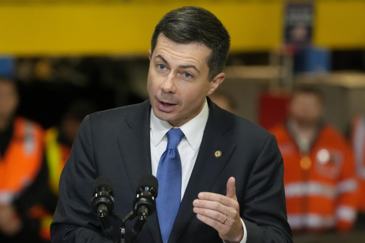 FILE - Transportation Secretary Pete Buttigieg speaks before the arrival of President Joe Biden at the construction site of the Hudson Tunnel Project, Tuesday, Jan. 31, 2023, in New York. Nearly 50 businesses and nonprofits including rideshare companies Uber and Lyft, industrial giant 3M and automaker Honda are pledging millions of dollars in initiatives to stem a "crisis" in road fatalities under a new federal effort announced Friday, Feb. 3.