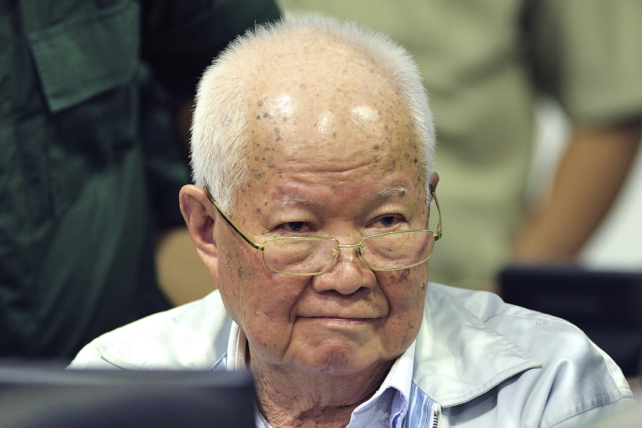 FILE - Khieu Samphan, former Khmer Rouge head of state, sits in a court during a hearing at the U.N.-backed war crimes tribunal in Phnom Penh, Cambodia on Nov. 16, 2018. Samphan, who was convicted by a U.N.-backed tribunal of  genocide, crimes against humanity and war crimes for his role as a leader of the communist Khmer Rouge when they ruled Cambodia in 1975-1979, has been transferred from the tribunal's jail to serve his life sentence at a Cambodian state prison.