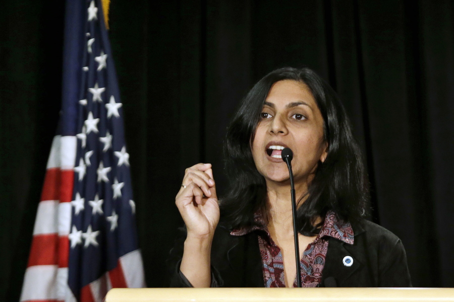 FILE - New Seattle City Councilmember Kshama Sawant speaks during an inauguration ceremony for city officials Monday, Jan. 6, 2014, in Seattle. One of Sawant's earliest memories of the caste system was hearing her grandfather - a man she "otherwise loved very much" - utter a slur to summon their lower-caste maid. Now an elected official in a city thousands of miles from India, she has proposed an ordinance to add caste to Seattle's anti-discrimination laws.